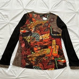 Long sleeve blouse with colorful designs, graphics, and textures. Size XL.